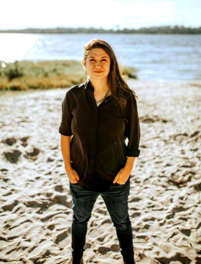 Photo of author, Jett Farrell-Vega, standing in front of Florida lake